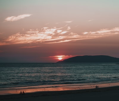 Mountain sunset view of the blue sea
